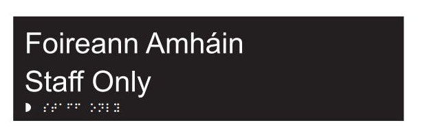 Black sign with white text 'Foireann Amháin Staff Only' on a white background